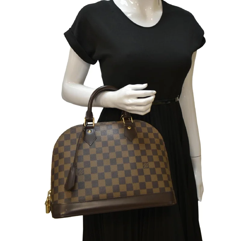 Louis Vuitton Speedy bags in monogram canvas for a classic lookLOUIS VUITTON Alma PM Damier Ebene Satchel Bag Brown