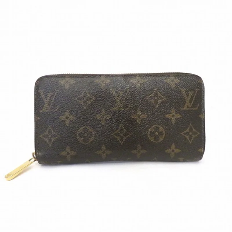 Louis Vuitton bags with a snap - button closure and a decorative charm for styleLouis Vuitton Brown Canvas Zippy wallet wallet accessories