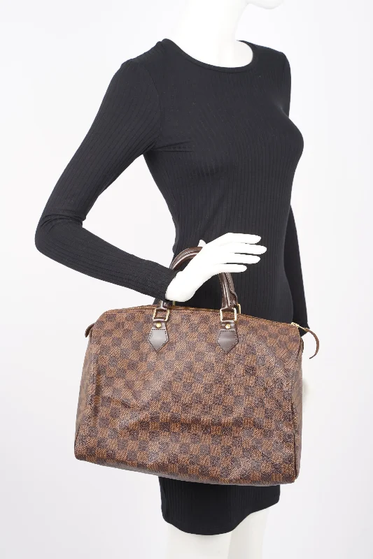 Louis Vuitton Twist bags with a snakeskin - effect panel for a bold lookLouis Vuitton Speedy Damier Ebene 35