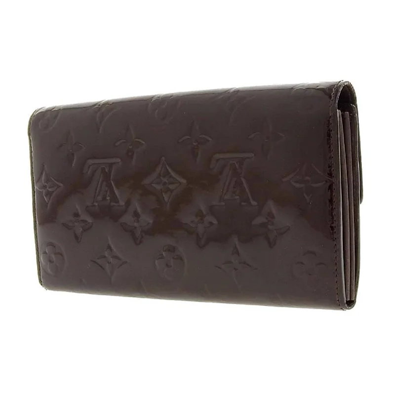 Louis Vuitton Twist bags with a snakeskin - effect panel for a bold lookLouis Vuitton Brown Patent leather Sarah wallet accessories