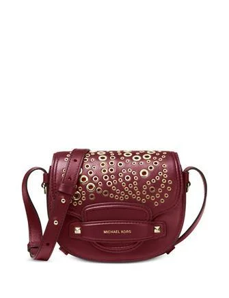 smooth leather Michael Michael Kors handbags for a sleek lookMichael Michael Kors Mini Embellished Saddle Crossbody