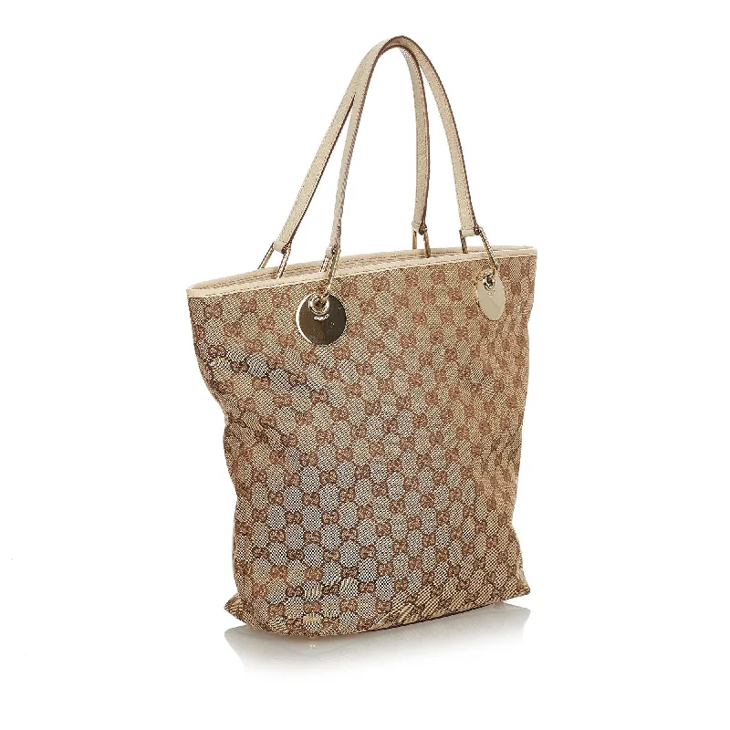 Gucci tote bags for women with a printed Gucci logoGucci GG Canvas Eclipse Tote Bag (31932)