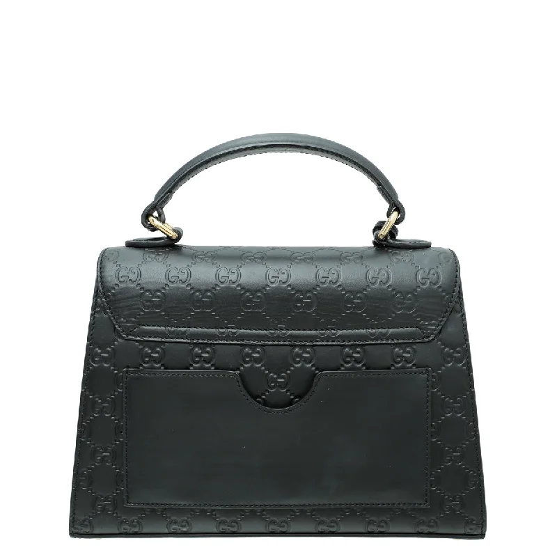 Women Gucci Sylvie bags with a monogram - embossed leatherGucci Black GG Guccissima Top Handle Small Bag